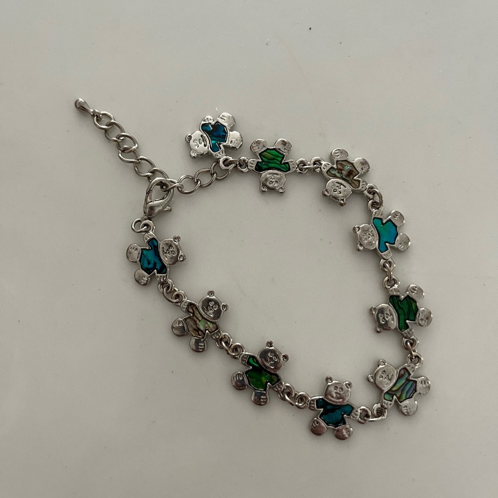 Adorable silver tone teddy bear bracelet.  Measures 7” long plus 2” extender.